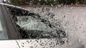 car accident picture of broken glass flying 
